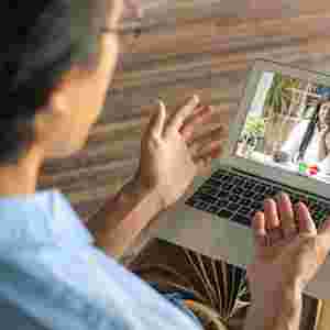 Man video calling his coach to have a virtual session stock photo