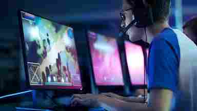 A gamer boy is playing games on the PC. teen computer gaming Charisma