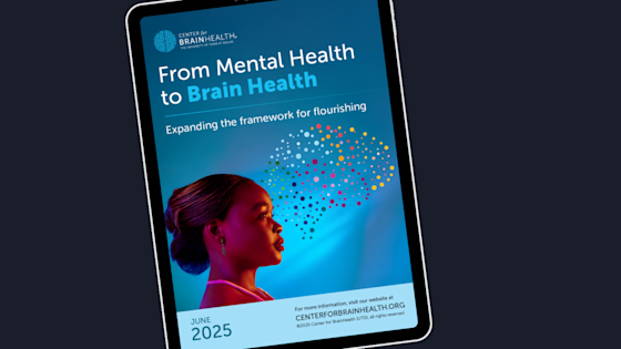 Graphic of a tablet showing the cover image from the June 2025 BrainHealth White Paper - From Mental Health to Brain Health: Expanding the Framework for Flourishing.