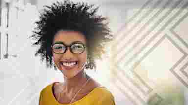 Happy young woman looking at camera.