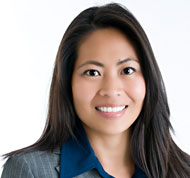 Portrait of Dr. Francesca Filbey in suit.