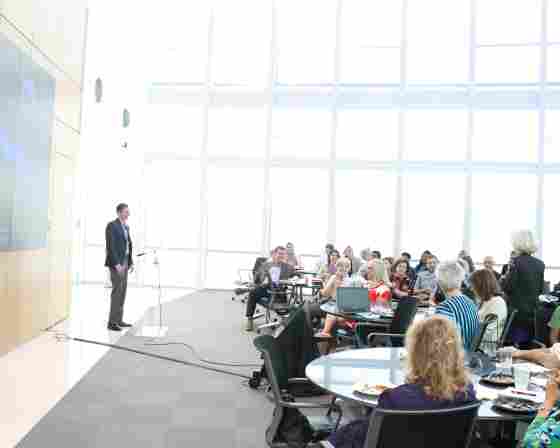 Dr. Sandi Chapman asks a question during a live Frontiers of BrainHealth talk inside Center for BrainHealth's Brain Performance Institute.