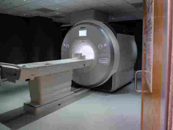 Wide-shot shot (5) of MRI Machine in imaging center. Door shows. 