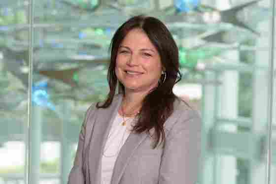 Cecilia Perez-Verdia in a gray blazer with blue and green lights, horizontal. Digital Brand Manager- hero.