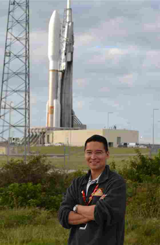 Steven Lee of NASA's Jet Propulsion Lab standing in front of the MSL Atlas V rocket.