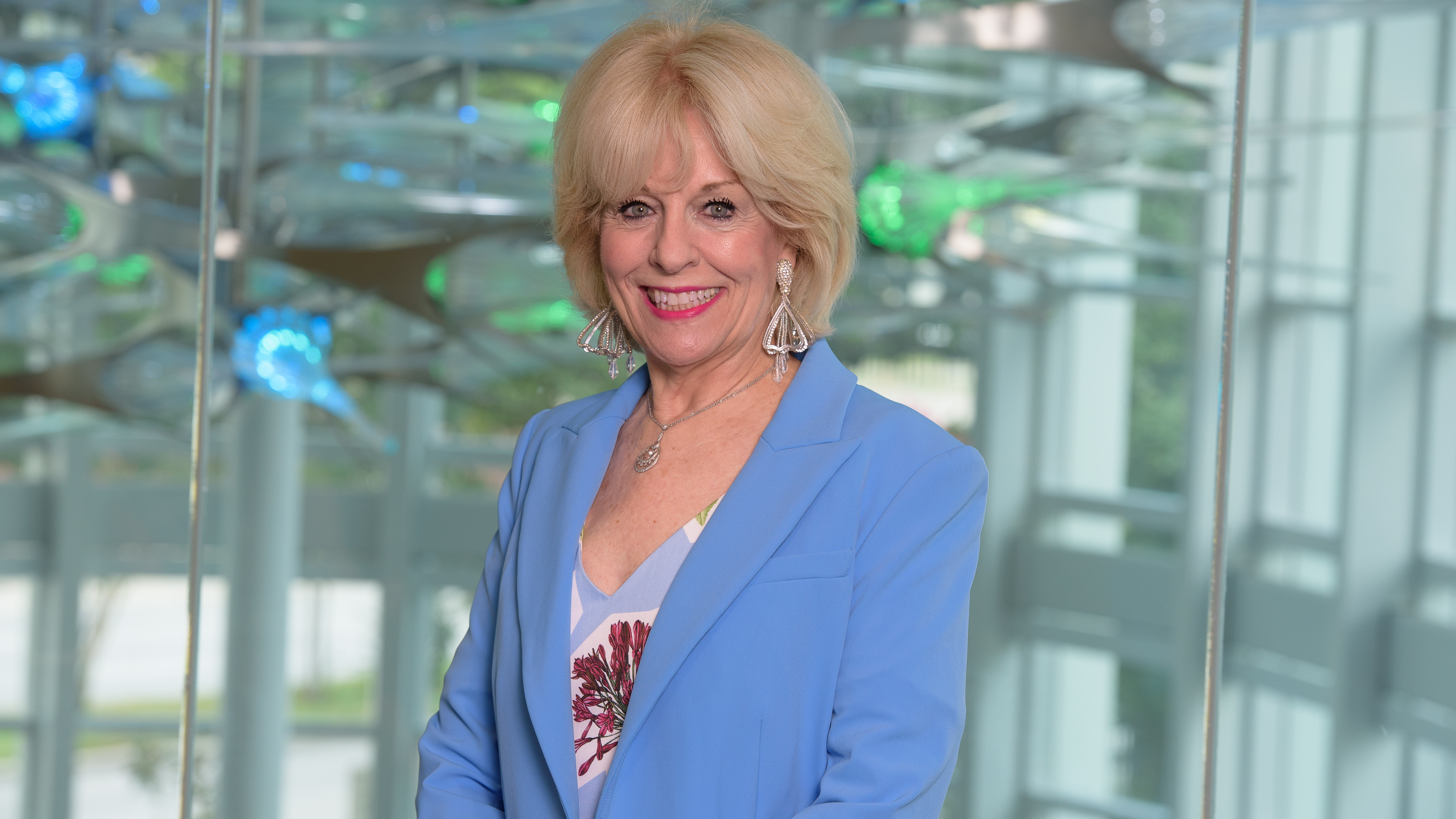 Sandra Chapman infront of an art sculpture 