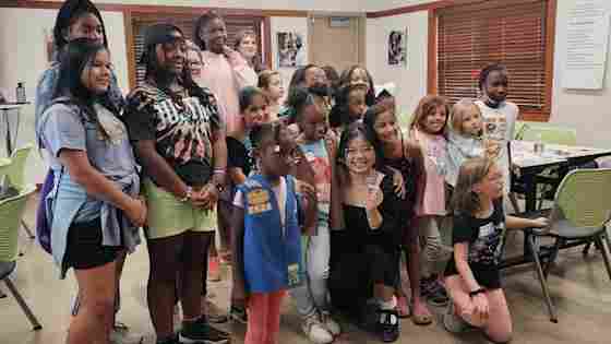 Girl Scouts of Northeast Texas and BrainHealth intern Jade Nguyen unveiling the new BrainHealth Patch.