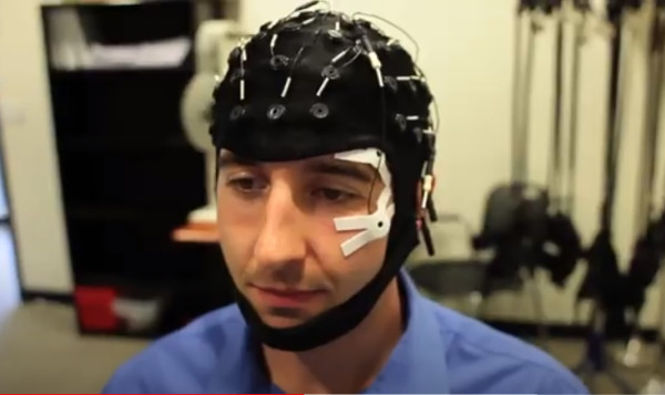 EEG Electrical simulation and measure; Man in EEG headset