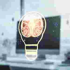 A light bulb illustration with human brain on modern computer background.