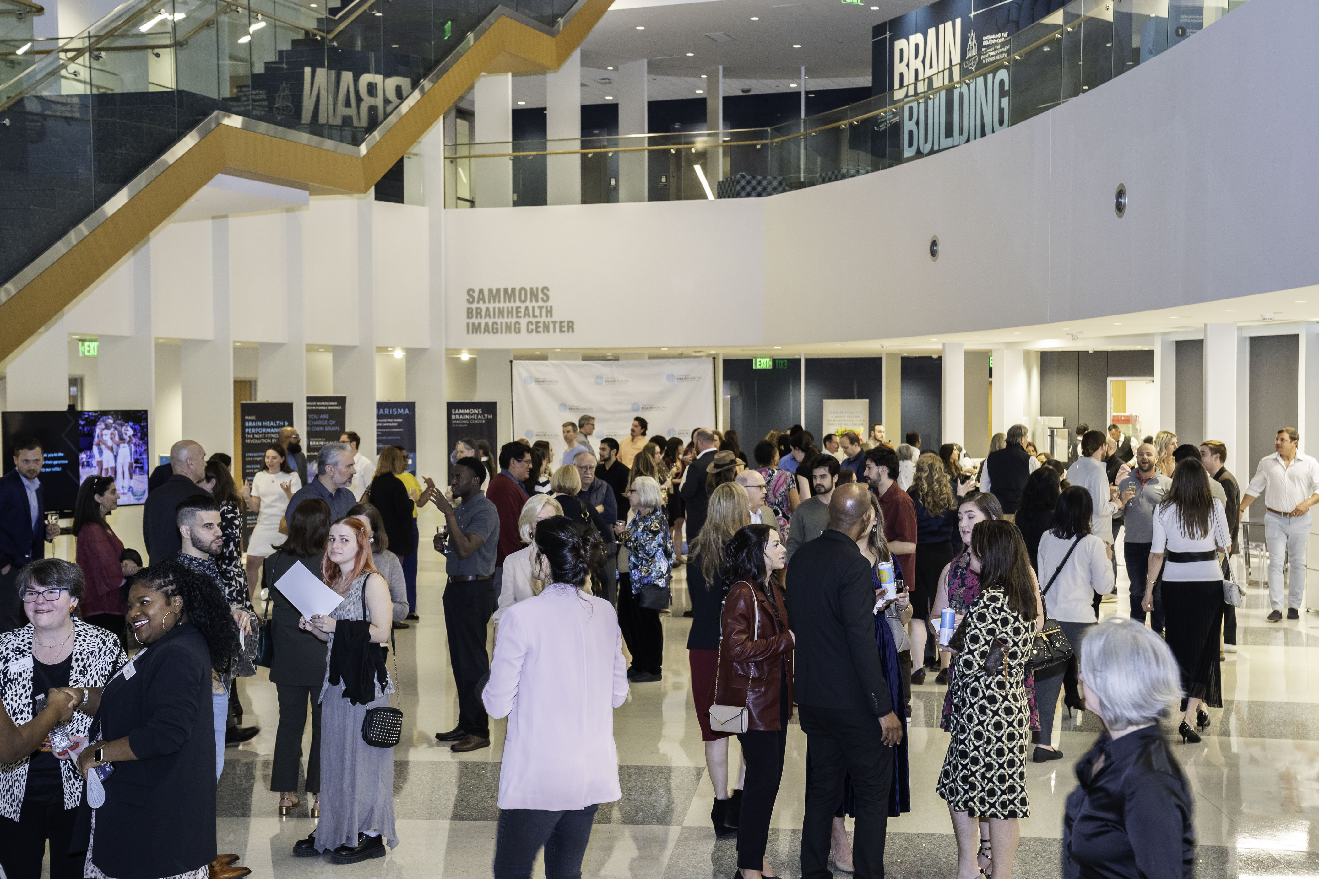 Guests attend an art event and happy hour reception at Center for BrainHealth in Dallas, Texas. 