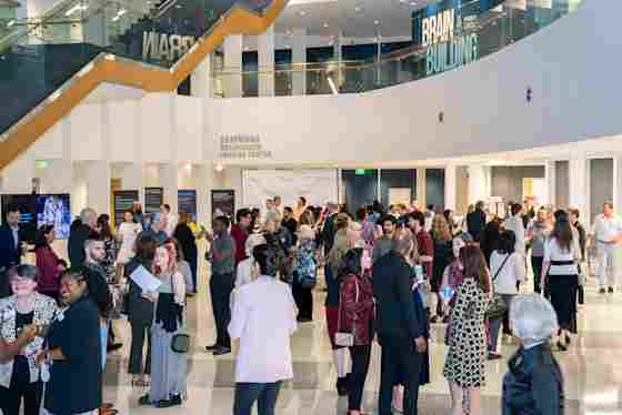 Guests attend an art event and happy hour reception at Center for BrainHealth in Dallas, Texas.