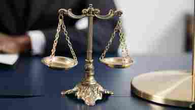 Picture of a double-pan balance scale, ready to way each side against the other.