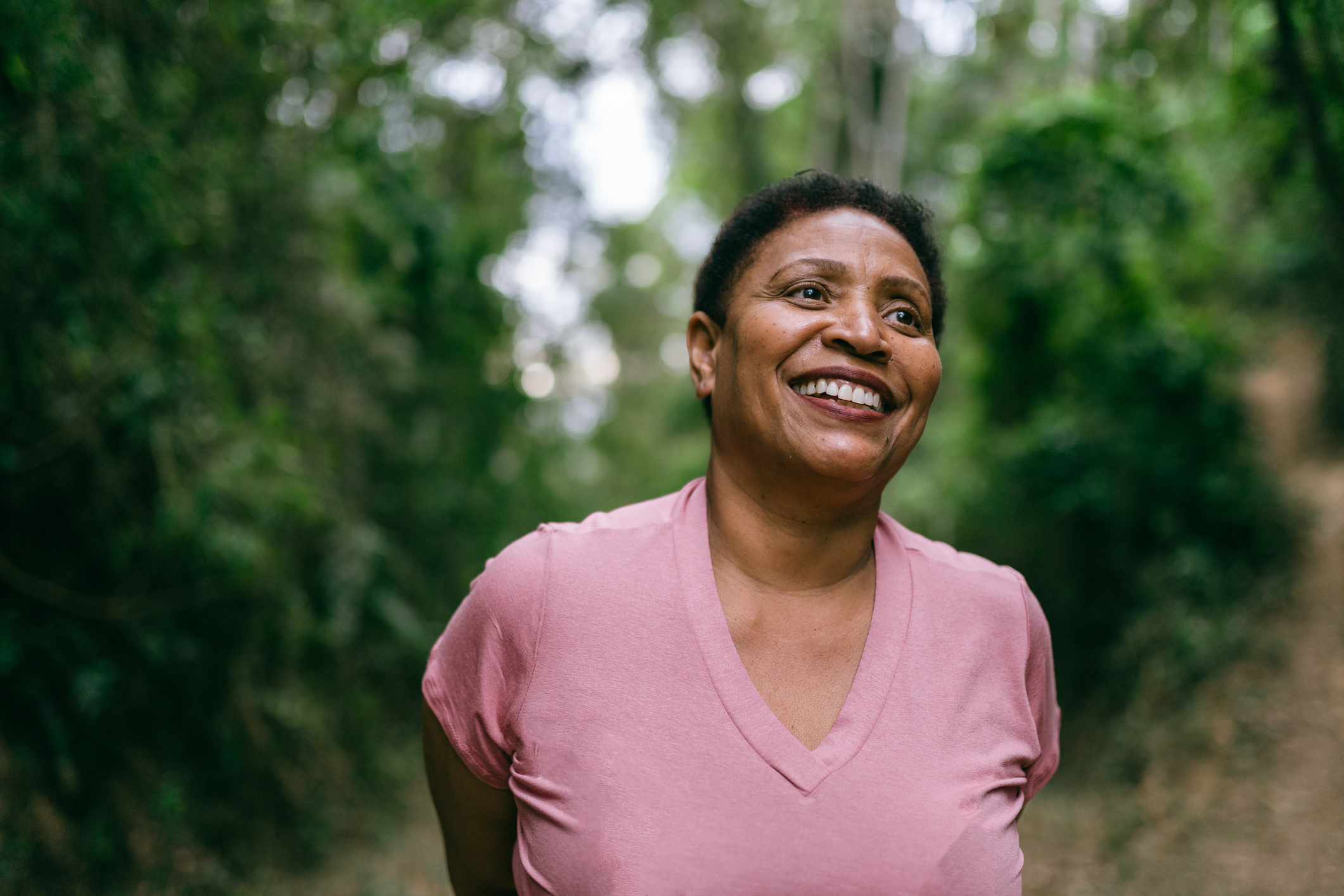 Mature woman contemplating in nature.