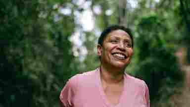Mature woman contemplating in nature.