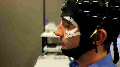 Man looking left in EEG headset