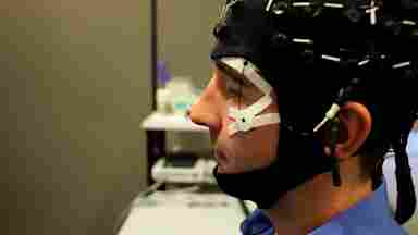 Man looking left in EEG headset