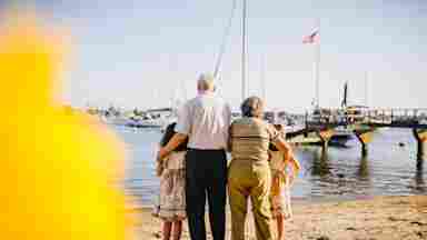 Grandparents with Grandchildren standing by the shore