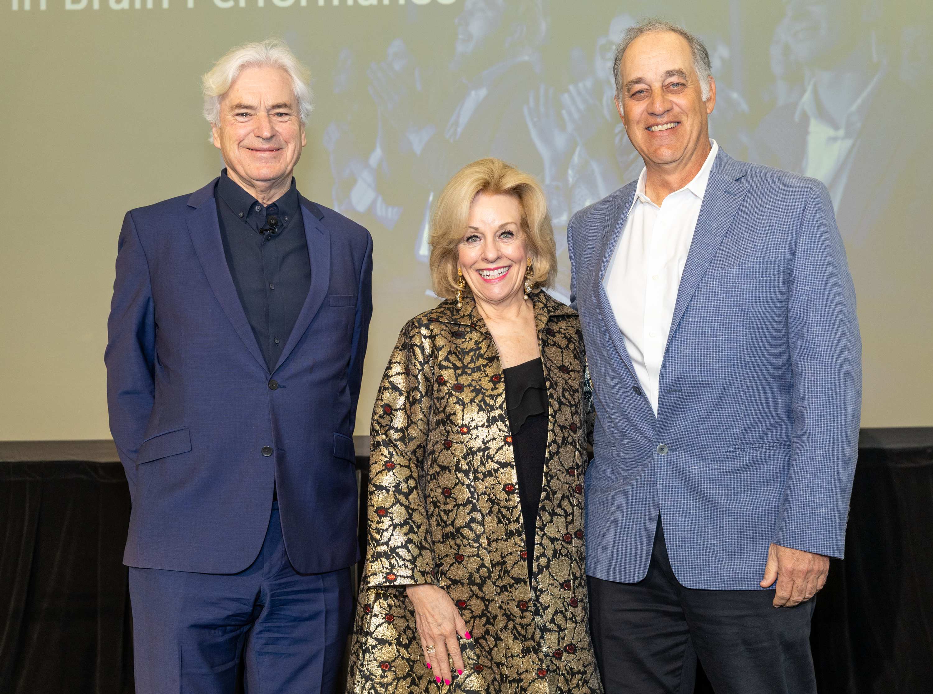 Ian Robertson, PhD, Sandi Chapman, PhD, and Mark D'Esposito, MD, stand on stage after a panel discussion at BrainHealth Week 2025.