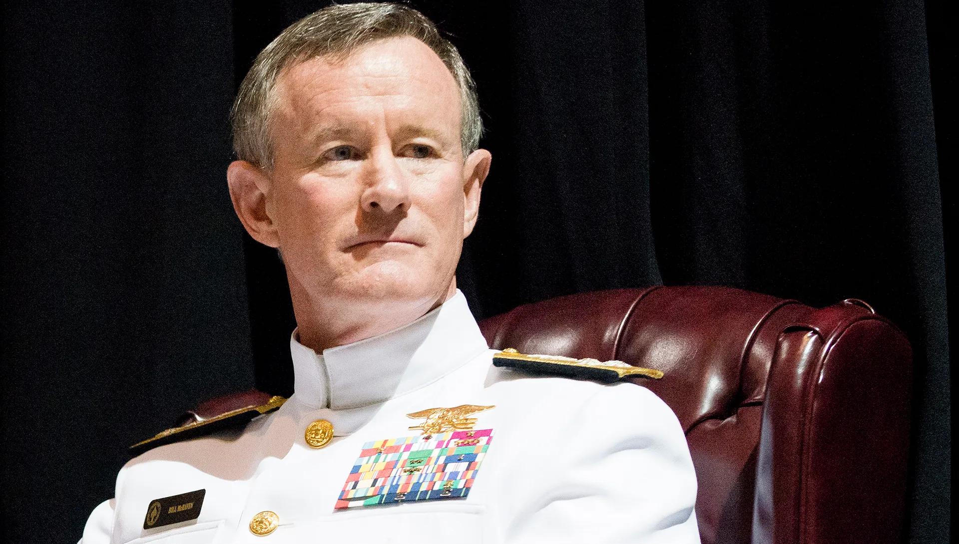 A photograph of Admiral William H. McRaven in a white uniform looking off to his right.
