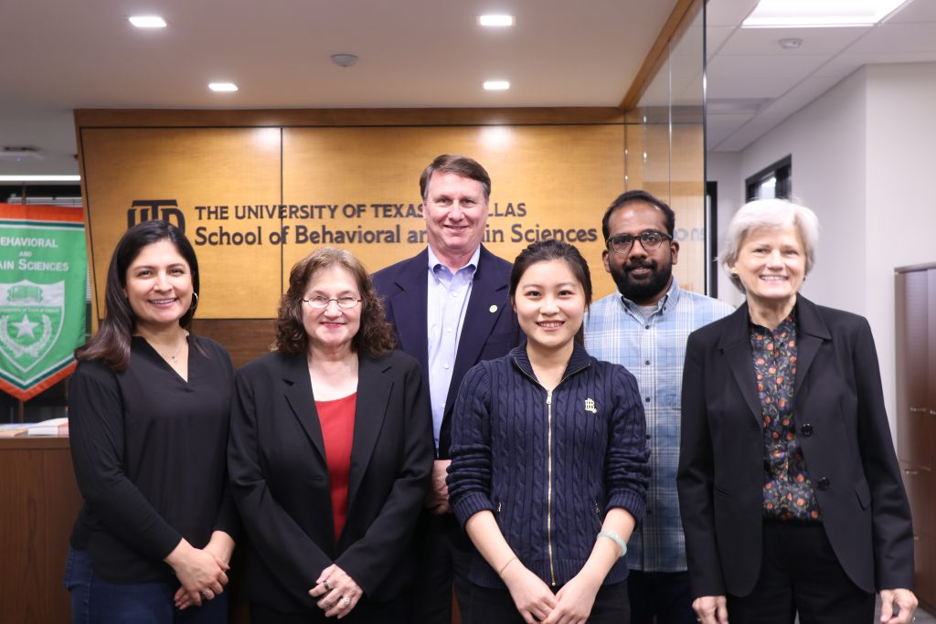 a group photo in the school of behavioral and brain science hall