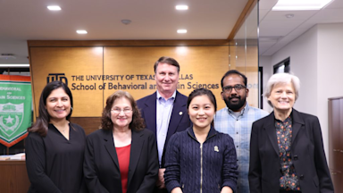 a group photo in the school of behavioral and brain science hall