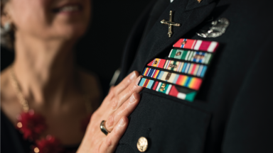 Veteran and his spouse embrace.