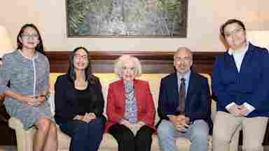 Scientists participating in research supported by the 2026 Friends of BrainHealth campaign, seated with Ramona Jones (center), the namesake of the current scientist selection luncheon and research competition event.