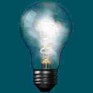A floating light bulb that has white smoke with a teal background.