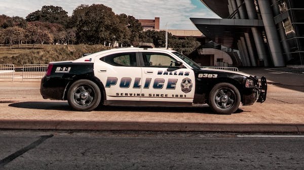 Police car parked near a building.