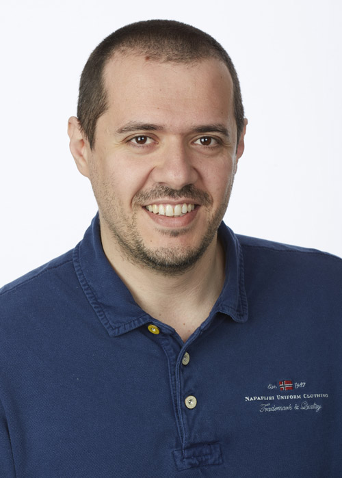 A headshot of Dr. Vincenzo Fiore, Ph.D. who is smiling and wearing a navy blue shirt.