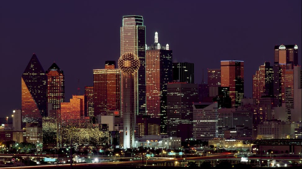 Brown building with lights on during night time