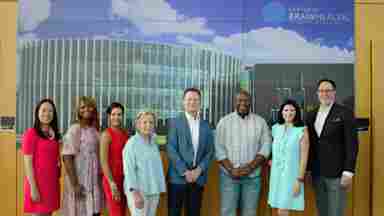 Some of Center for BrainHealth's new 2024-2025 advisory board members meet inside the Brain Performance Institute.