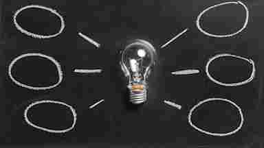 A light bulb on a black background
