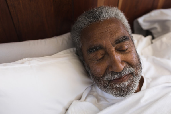 Close-up of a senior man sleeping peacefully.