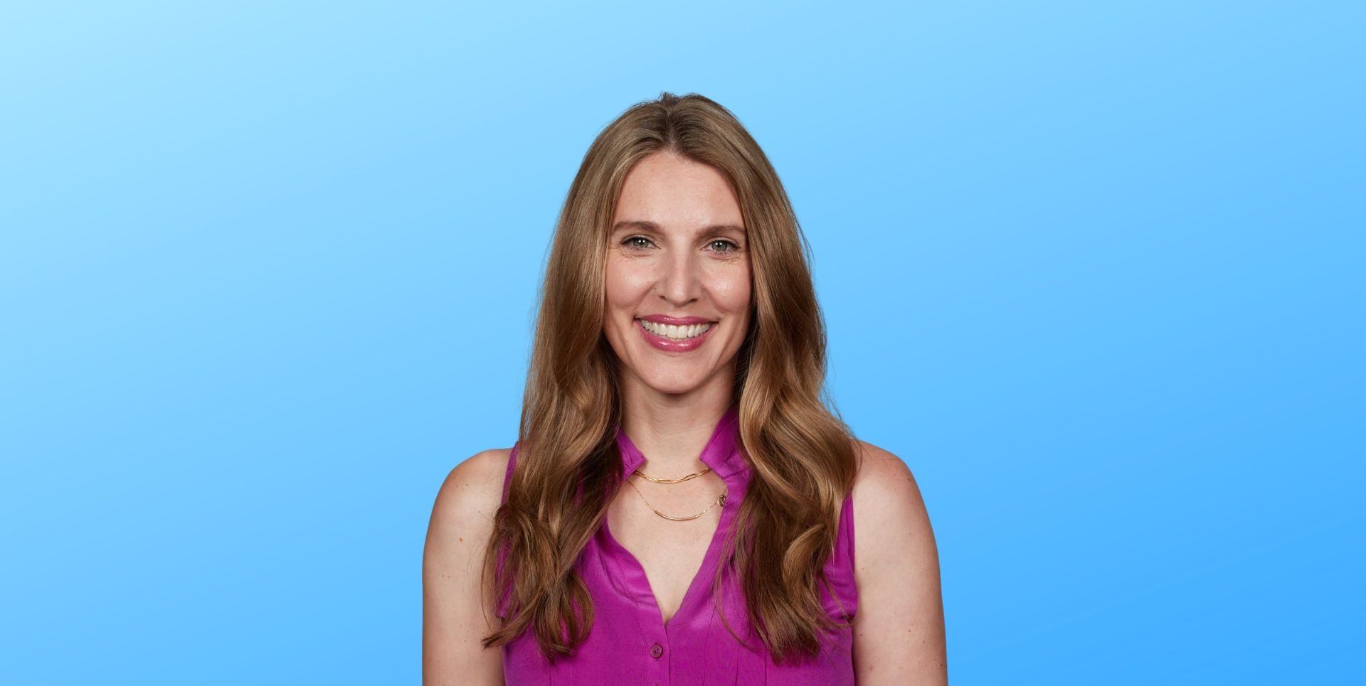 Headshot of Rebecca Fischer in a pink shirt against a gradient blue background.