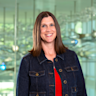 Headshot of Krystal Sexton, PhD, standing in front of glass neuron sculptures at Center for BrainHealth in Dallas, Texas.