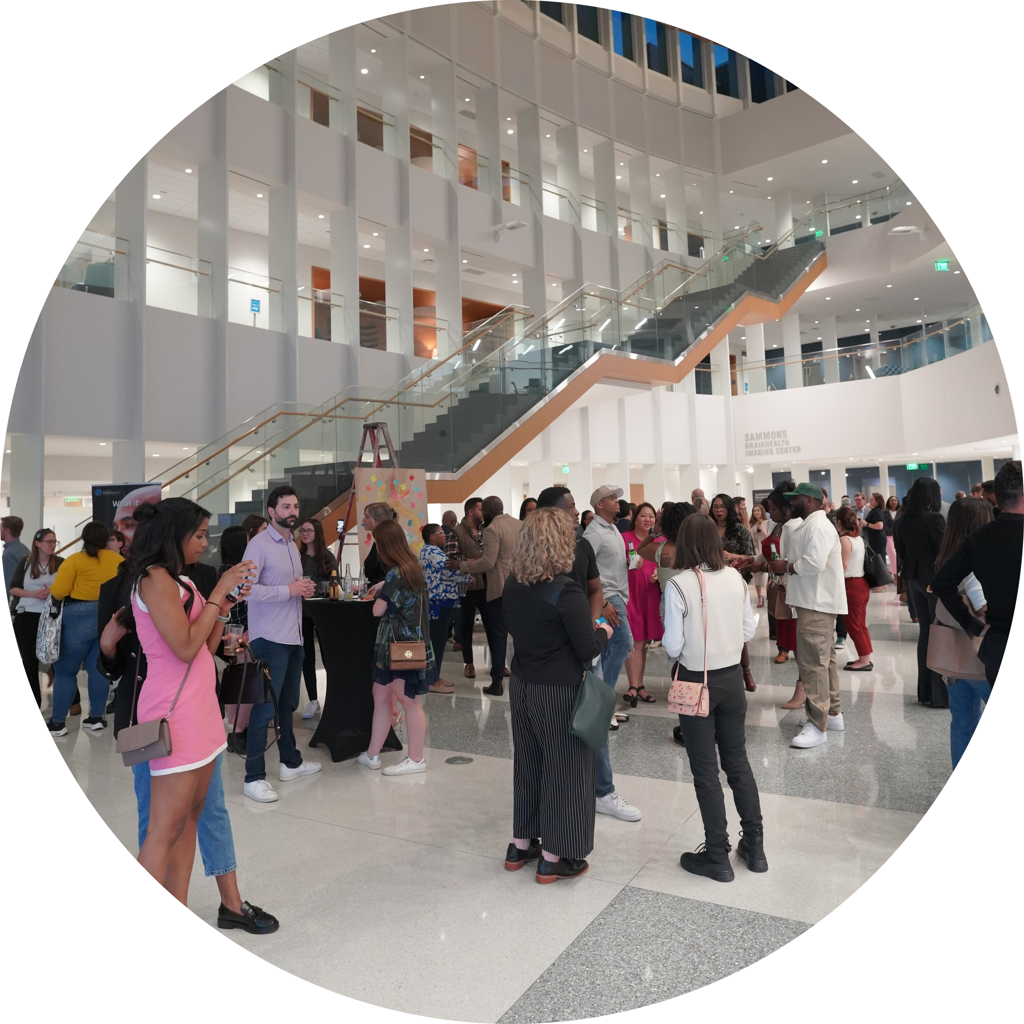 The crowd mingles and enjoys the Art-Infused Happy Hour at BrainHealth Week 2023.