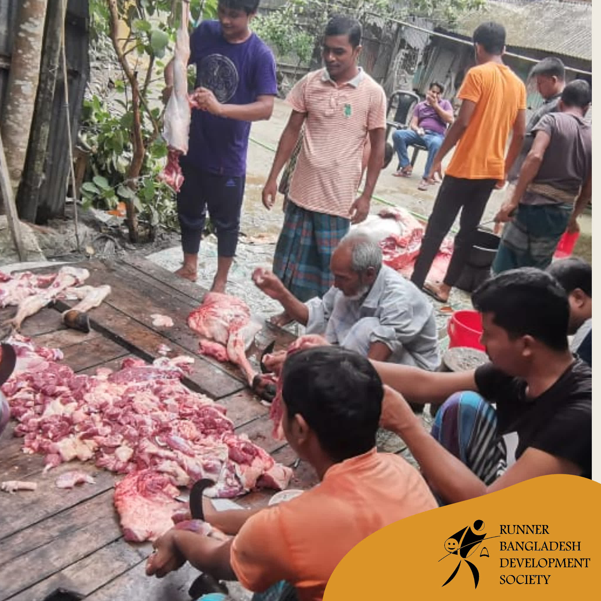 Butchers at work cutting down meat to be distributed in Sonagazi, Feni