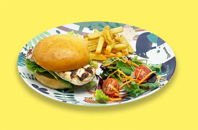 A kids meal including a grilled chicken burger, fries and mixed salad