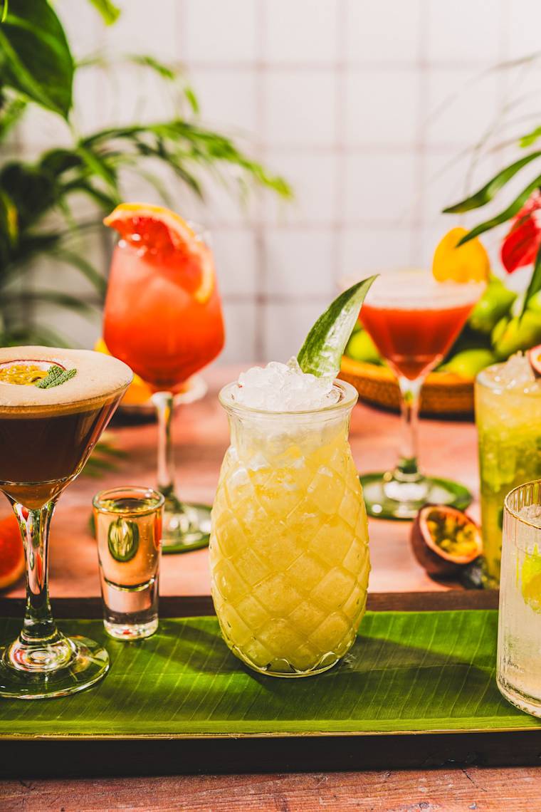 A selection of cocktails including passionfruit martini and pina colada, served for group bookings, hen parties and stag dos at Las Iguanas