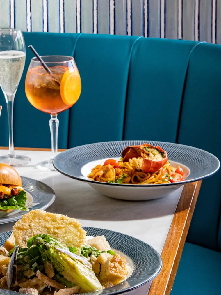 Table filled with colourful Italian dishes
