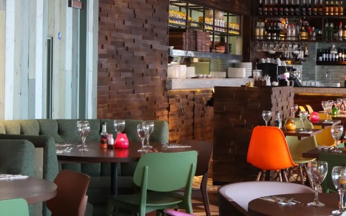 Wood panelling, brick walls and colourful seating at Las Iguanas Kingston