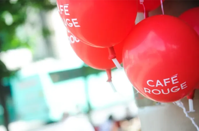 Red balloons with Cafe Rouge logo