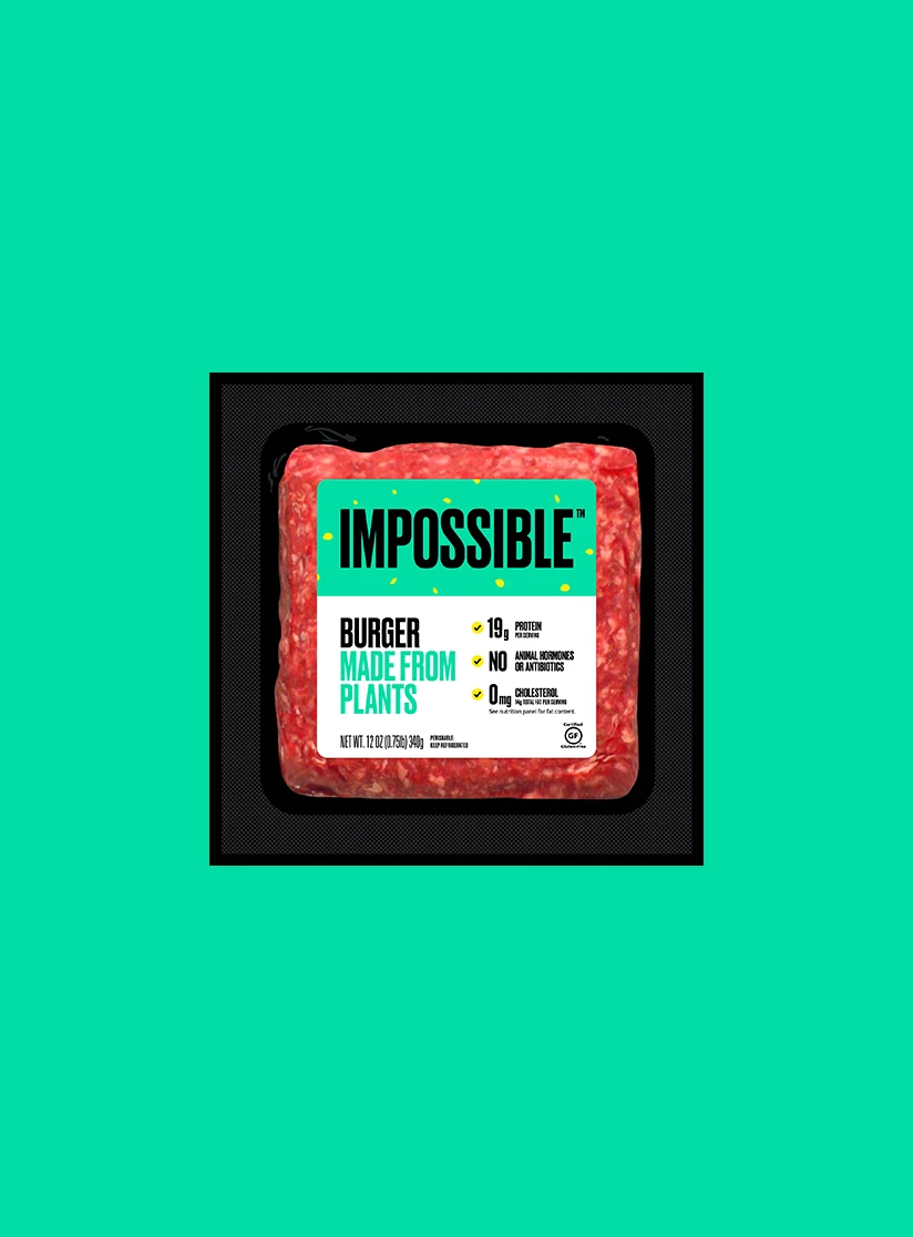 Impossible Burger 12 oz raw brick available in grocery stores on green background