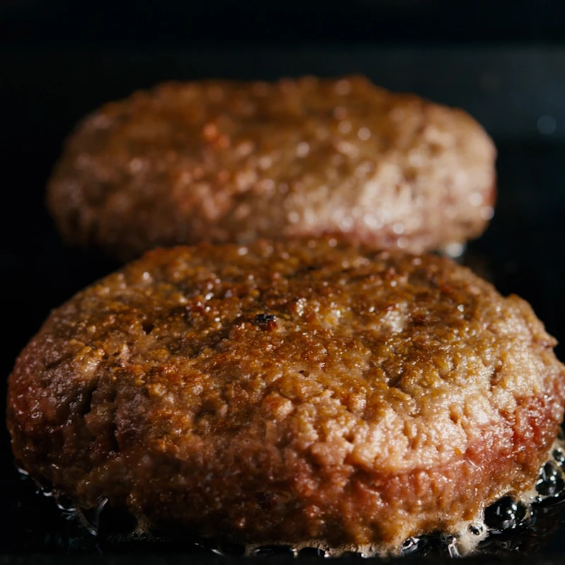 Impossible Burger patties cooked on the flattop grill we love meat