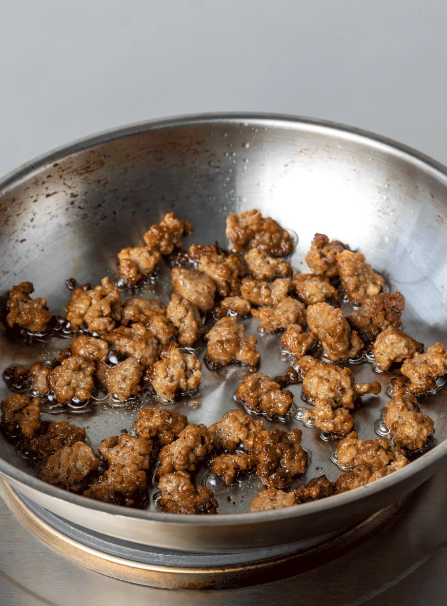 Impossible sausage crumbles cooking in a pan