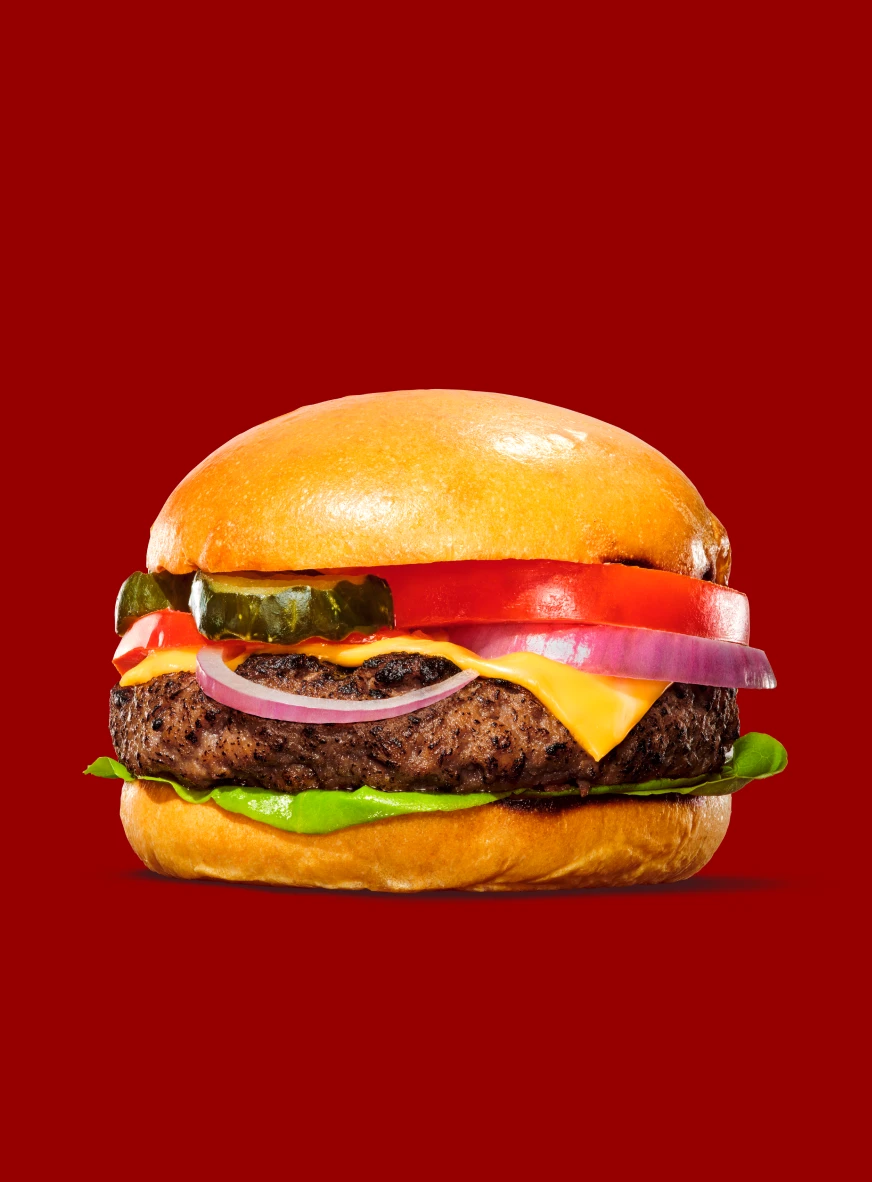 Impossible beef for foodservice showcased within a cheeseburger