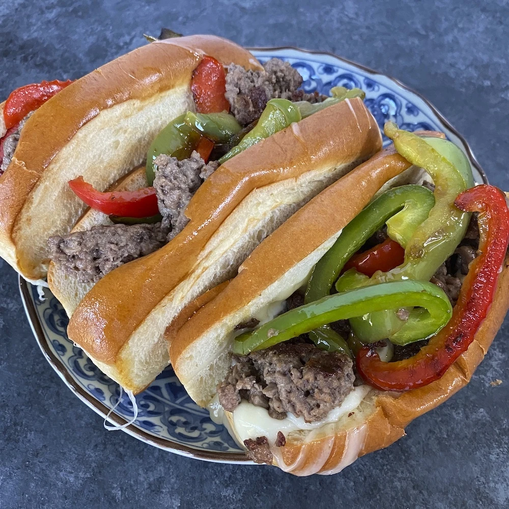 Chef My Nyugen prepares this Impossible™ Philly Cheeseburger Recipe prepared on a brioche bun.