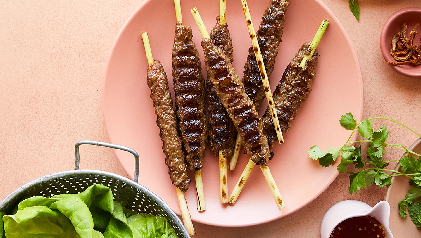 Impossible Burger lemongrass skewers grilled on pink plate