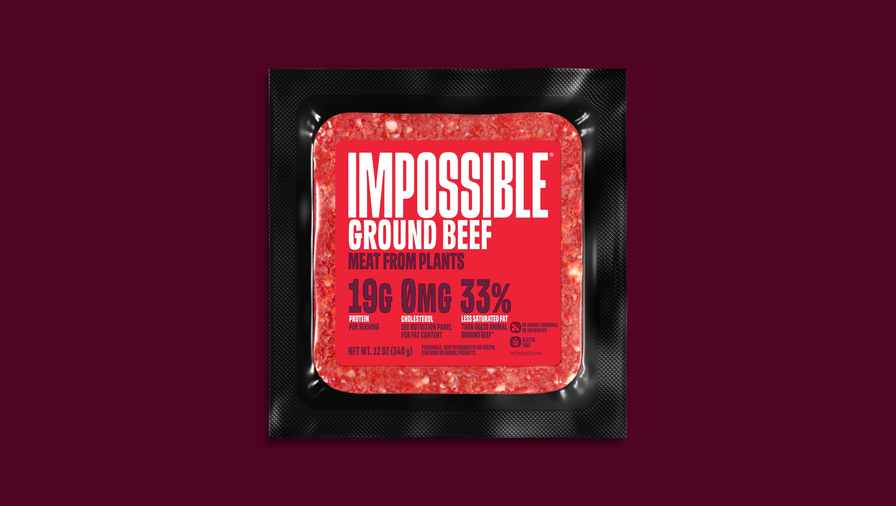 Front of pack of Impossible Ground Beef meat from plants on a dark background.